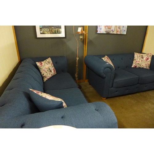 1356 - A navy blue textured weave Chesterfield style three seater sofa and two seater sofa and with floral ... 