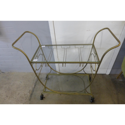 1389 - A gold metal and glass drinks trolley