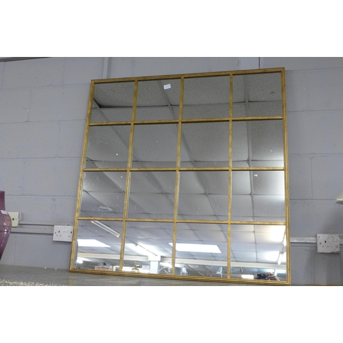 1415 - A large gold framed window mirror