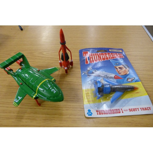 676 - Thunderbirds; annual, albums 1-6, book of Technical Data, model Thunderbird 1,2,3 and 4, coffee mug,... 