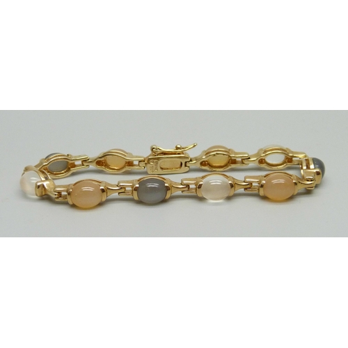 1001 - A silver gilt and moonstone bracelet