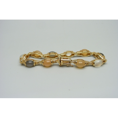 1001 - A silver gilt and moonstone bracelet