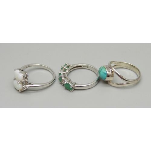 1010 - Three sterling silver rings set with turquoise, opals and emeralds