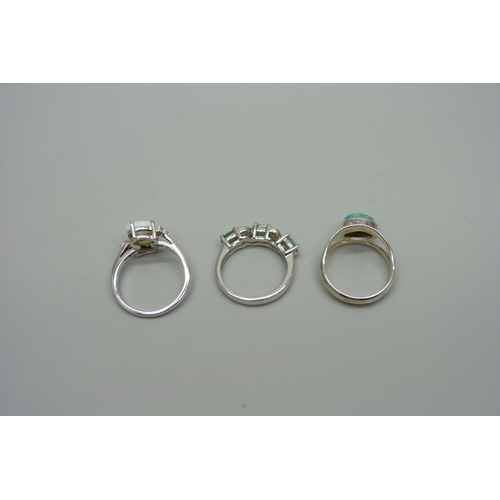 1010 - Three sterling silver rings set with turquoise, opals and emeralds