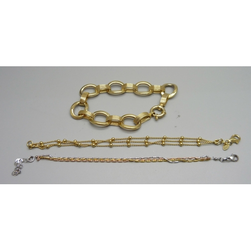 1011 - Three silver gilt bracelets