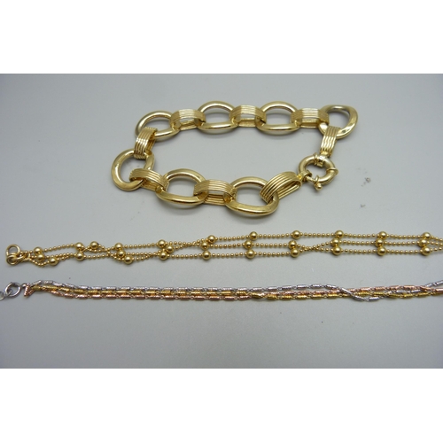 1011 - Three silver gilt bracelets