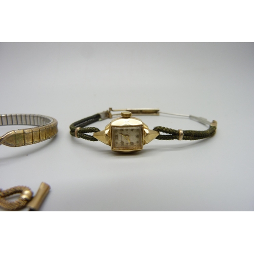 1024 - A lady's 14ct gold Bulova wristwatch, a Hamilton wristwatch and a bracelet