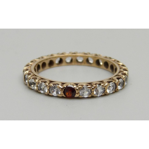 1032 - A 9ct gold, diamond and ruby ring and a yellow metal, white stone and garnet ring, 3.4g total weight