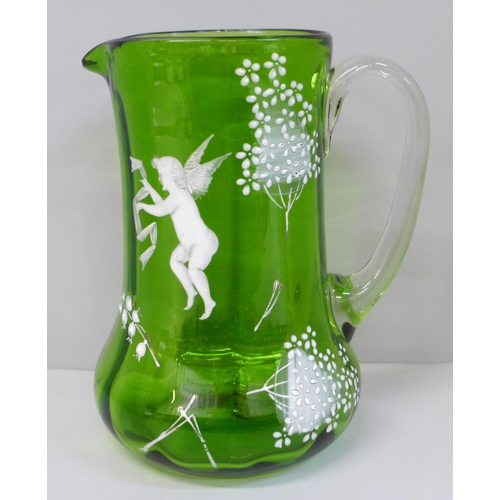 605 - A Mary Gregory green glass jug, 18cm