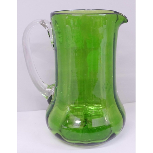 605 - A Mary Gregory green glass jug, 18cm