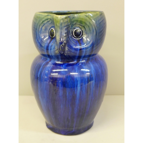 611 - A Danesby ware blue owl jug, 15.5cm