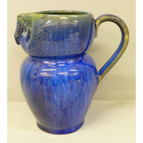 611 - A Danesby ware blue owl jug, 15.5cm