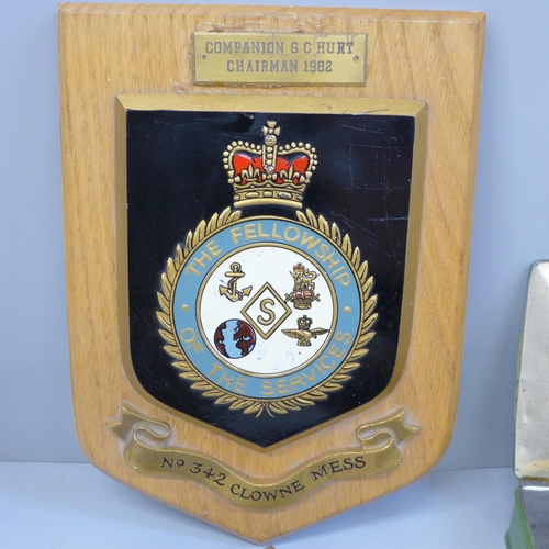 628 - A mess hall plaque and a collection of military badges