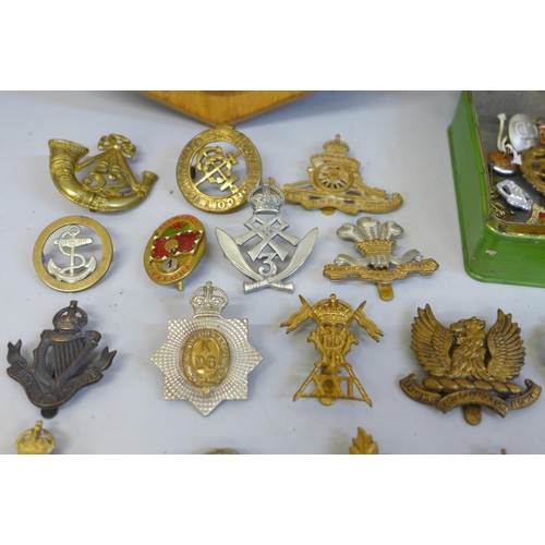 628 - A mess hall plaque and a collection of military badges