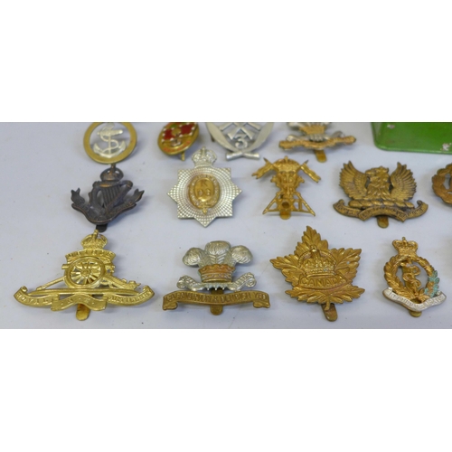 628 - A mess hall plaque and a collection of military badges