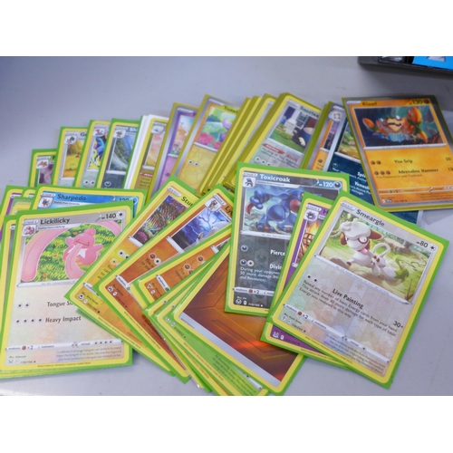 630 - Pokemon cards; 50 Holographic with large quantity of protective sleeves and 25th Anniversary box