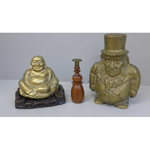 632 - A brass Transvaal money box, a brass Buddha and a wooden handled seal