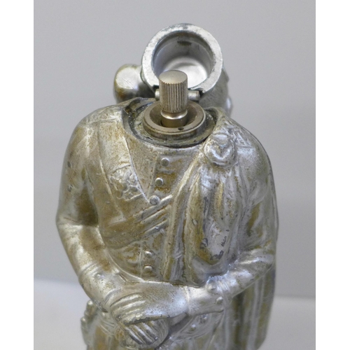 633 - A Scots Guards figural table lighter, 23cm