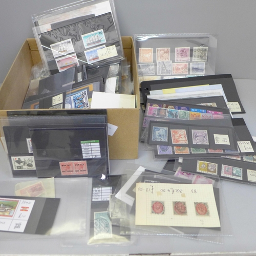 635 - Stamps; a box of stamps on stock cards and in packets