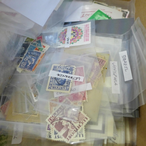 635 - Stamps; a box of stamps on stock cards and in packets