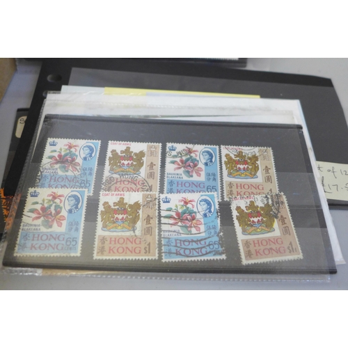 635 - Stamps; a box of stamps on stock cards and in packets