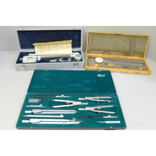 636 - A cased Kern technical drawing set, a dial caliper and one other instrument