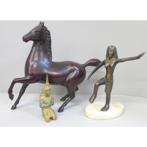 672 - A metal model of a horse and two other figures