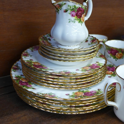 675 - A collection of Royal Albert Old Country Roses china including five saucers, six mugs, sugar bowl, m... 