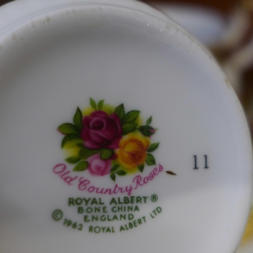 675 - A collection of Royal Albert Old Country Roses china including five saucers, six mugs, sugar bowl, m... 