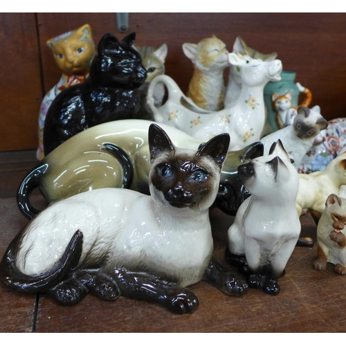 683 - A collection of cat figures including three Royal Doulton Siamese, Imari, a cream jug, Sylvac and a ... 