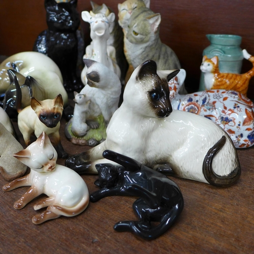 683 - A collection of cat figures including three Royal Doulton Siamese, Imari, a cream jug, Sylvac and a ... 