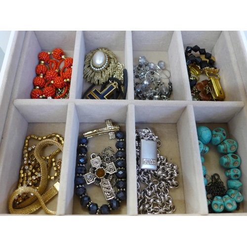 686 - A collection of cased costume jewellery including some silver