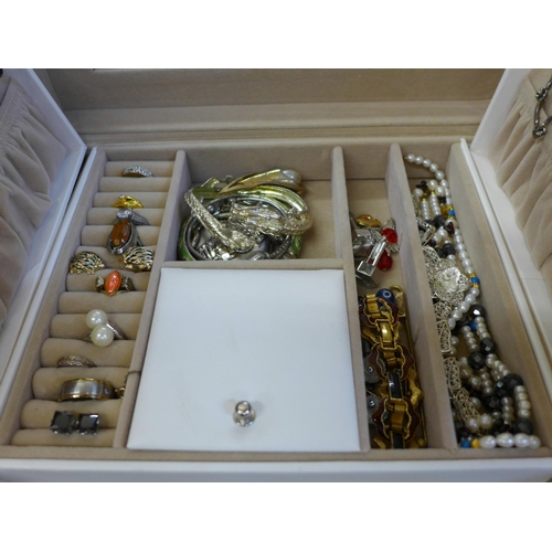 686 - A collection of cased costume jewellery including some silver