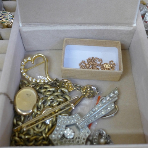 686 - A collection of cased costume jewellery including some silver