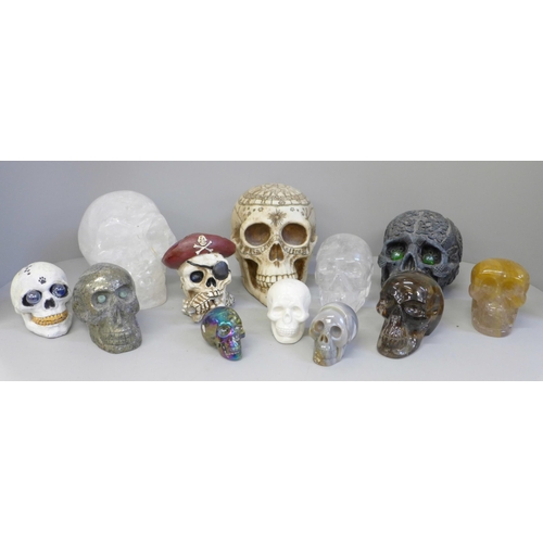 701 - A box of crystal skulls, resin skulls and others, twelve in total