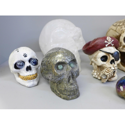 701 - A box of crystal skulls, resin skulls and others, twelve in total