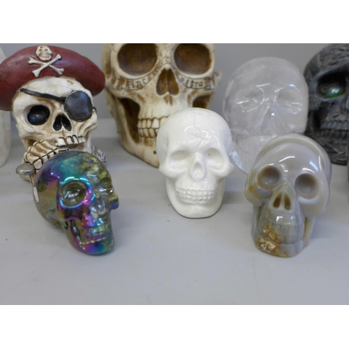 701 - A box of crystal skulls, resin skulls and others, twelve in total