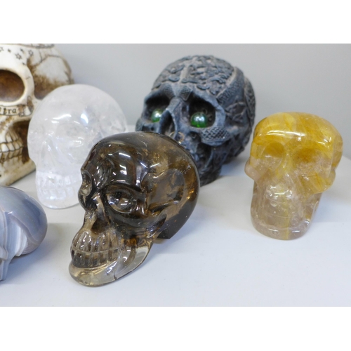 701 - A box of crystal skulls, resin skulls and others, twelve in total