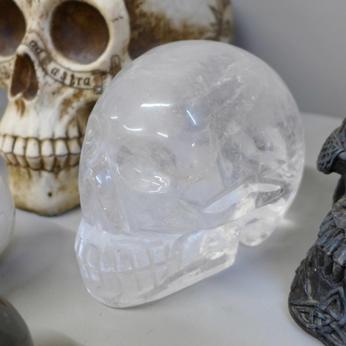 701 - A box of crystal skulls, resin skulls and others, twelve in total