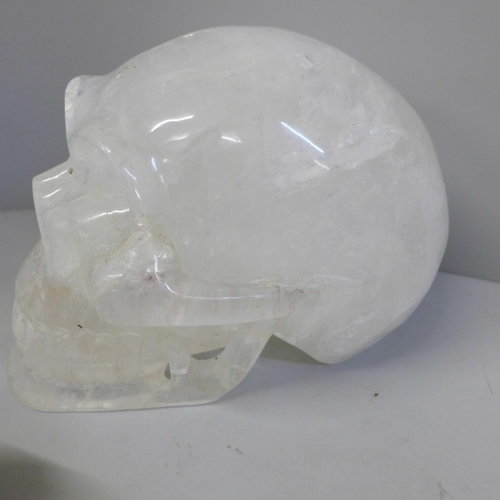 701 - A box of crystal skulls, resin skulls and others, twelve in total