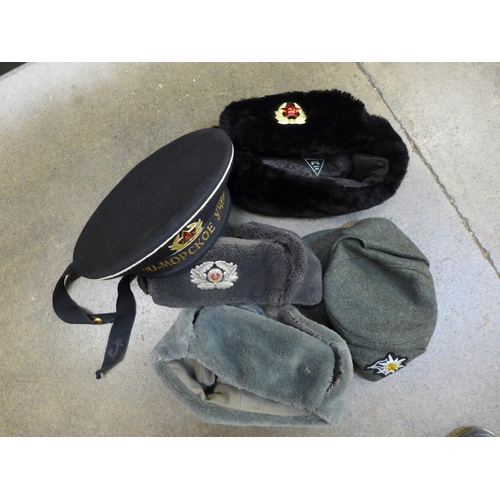 732 - A collection of military hats including Soviet Navy