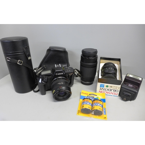 746 - A Canon EOS 650 camera with 35-70 lens and 70-210 lens, other accessories and a carrying bag