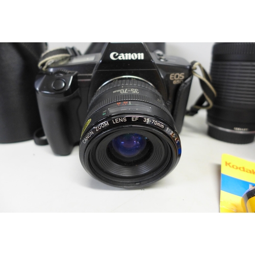 746 - A Canon EOS 650 camera with 35-70 lens and 70-210 lens, other accessories and a carrying bag