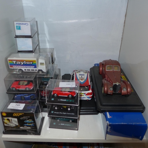 749 - Model vehicles including Burago Bugatti, Ford Rally car and a Weetabix lorry