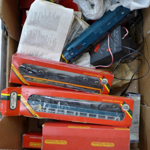 779 - A Hornby The Rover train set, one other part train set, a box of model rail and a box of die-cast mo... 