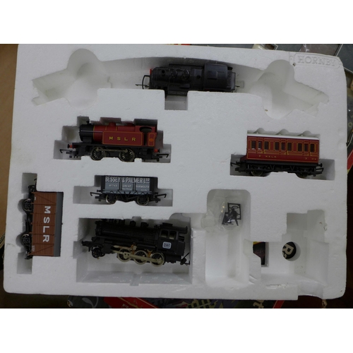 779 - A Hornby The Rover train set, one other part train set, a box of model rail and a box of die-cast mo... 