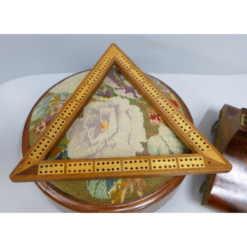 781 - A mahogany and gilt metal clock bracket, a cribbage board and a foot stool