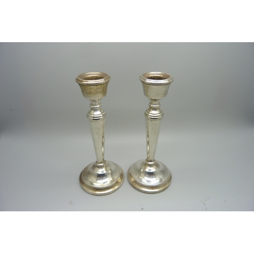 823 - A pair of silver candlesticks, 15cm