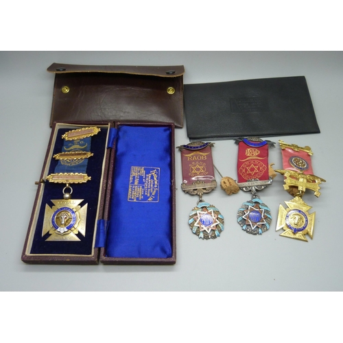 828 - Four silver lodge medals, one with three 9ct gold bars