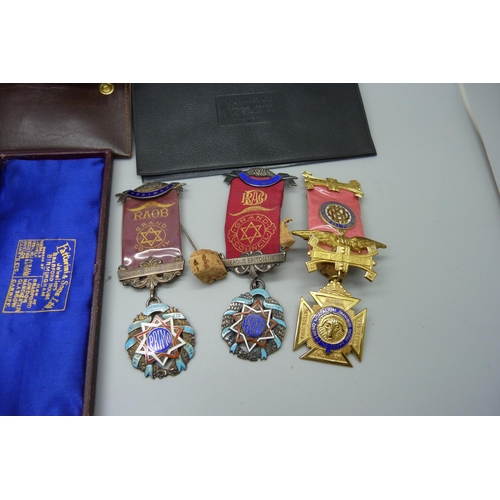 828 - Four silver lodge medals, one with three 9ct gold bars